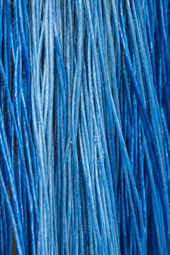 Cobalt blue vertical synthetic threads texture for modern abstract background.
