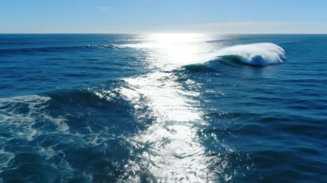 Powerful curling wave breaks in deep blue ocean under bright midday sun, cinematic aerial view of pristine surf conditions, ideal for travel, sports, and nature documentaries.