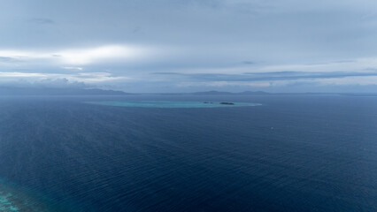 Fototapeta premium Drone Aerial View of Onok Island, Balabac, Philippines. Tropical Beach, Clear Water, Coral Reefs and Turtles.