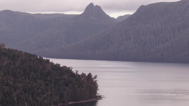 Mount Ossa peak over Lake St Clair in Tasmanian national park at sunrise &ndash; aerial.
