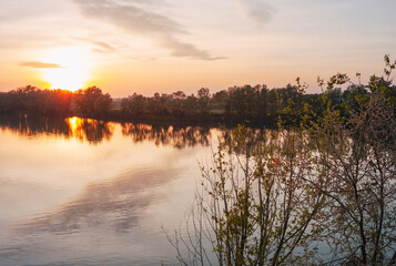 Sunset over the waters of Po river in the outskirts of the city of Casale Monferrato (Piedmont Northern Italy) capital of the same name winery region (UNESCO site). © stefanopez