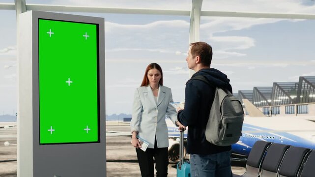 Green screen mockup, multiple passengers, looking at board panel, in international airport terminal, holding ticket and preparing for boarding. Chroma key in busy terminal with people.