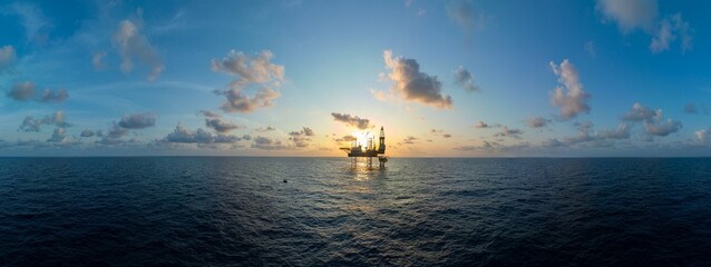 Aerial panoramic view of offshore jack up rig and offshore platform for oil and gas exploration and production. © bomboman