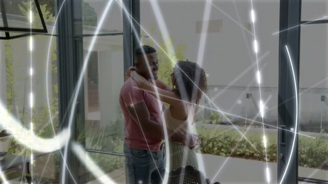 Couple standing hugging doors swaying leaning for love while light lines sweeping across frame, ads