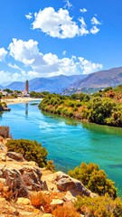 Obraz premium A serene landscape with a turquoise river flowing through a valley