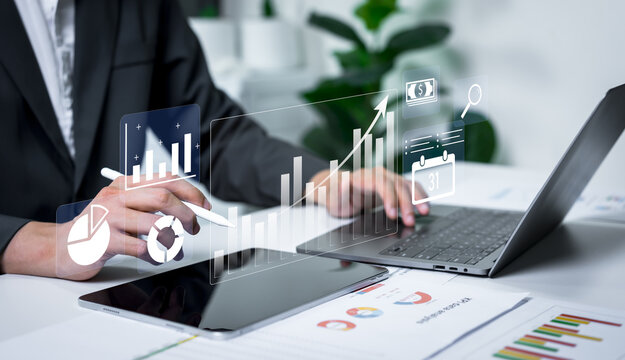 Businessman analyzing financial charts with business intelligence concept, banking analytics, market canvassing, data driven insights and corporate finance strategy.