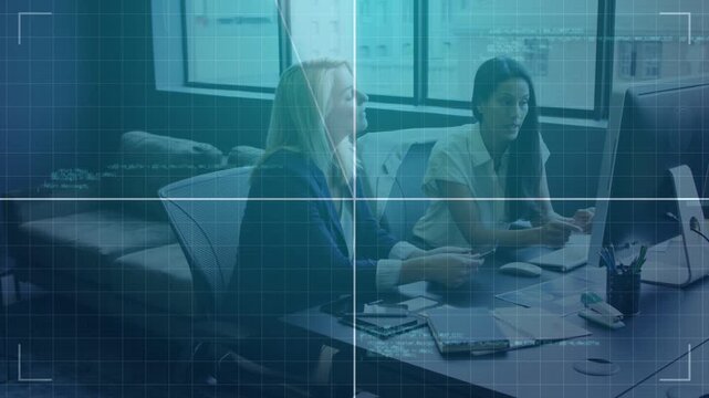 Two women reviewing business docs left pointing starting right tapping pad HUD partly hiding screen