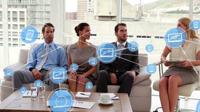 Turning three staff in suits watching host using tablet in office while digital overlay growing