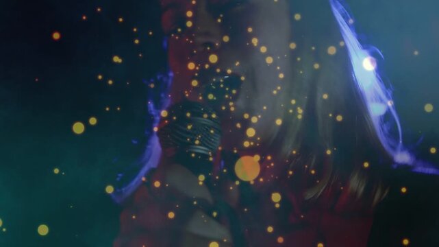 Camera shifting, golden bokeh floating, lead singer moving in, gripping mic, singing with feeling