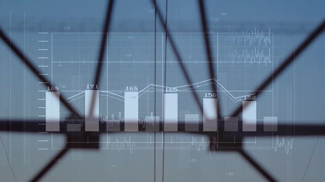 Central pylon standing at transmission route as data overlay updating over power lines near sunset