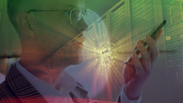 Mid-adult man in suit and glasses bringing phone closer after alert, checking in flare corridor