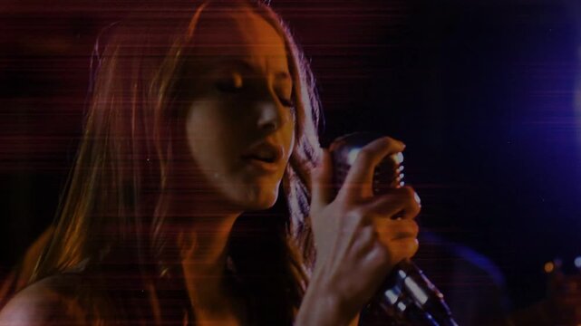 Female singer moving to retro mic, performing emotive song, bandmate backing, scanlines overlaying