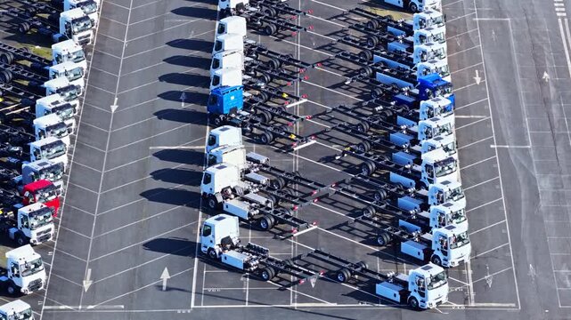 Aerial view of Renault trucks lined up outdoors at Gare A6 in sunlight