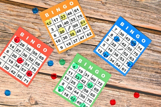Retro style bingo game cards on a rustic wooden table