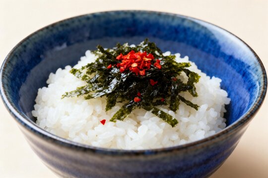 Bowl of rice with seaweed and chili