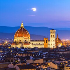 Fototapeta premium A serene cityscape at dusk with a large illuminated dome and tower