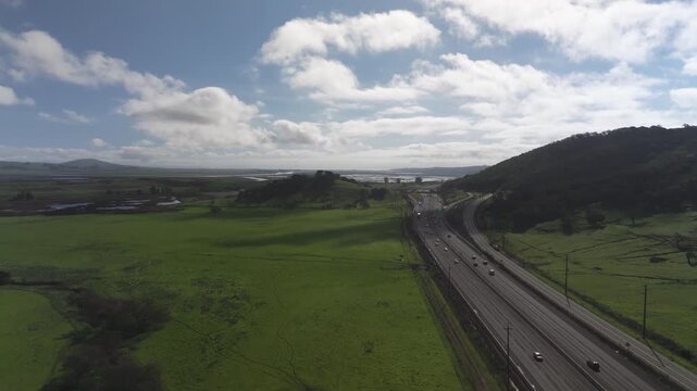 Green meadows by a highway