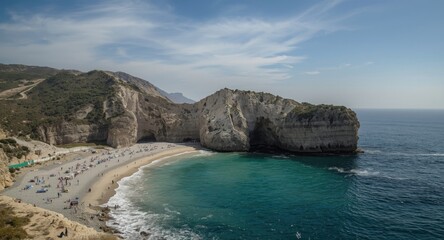 Fototapeta premium Rock formations with caves beside the sea
