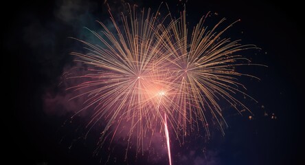 Fototapeta premium Shimmering fireworks display with radiant sparks and smoky trails glowing in the night at a festival