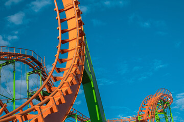 Orange Roller Coaster Track and Green Support Beams © jackreznor
