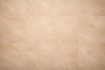 Fototapeta premium Textured beige marble tile wall with a smooth matte finish and copy space