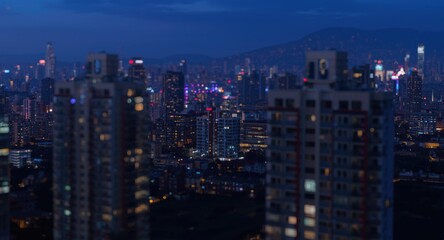 Naklejka premium Vibrant cityscape at twilight featuring modern apartment buildings with glowing blurred lights