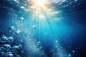 Obraz premium Sunlight filtering through underwater bubbles with ocean surface glow