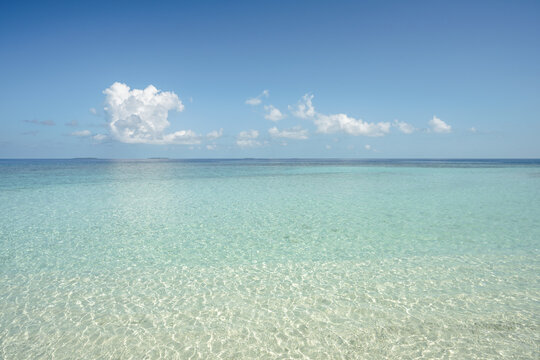 Transparent sea water and blue sky, Maldives, Indian Ocean