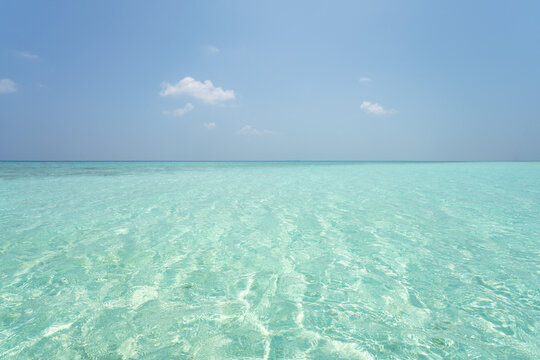 Transparent sea water and blue sky, Maldives, Indian Ocean