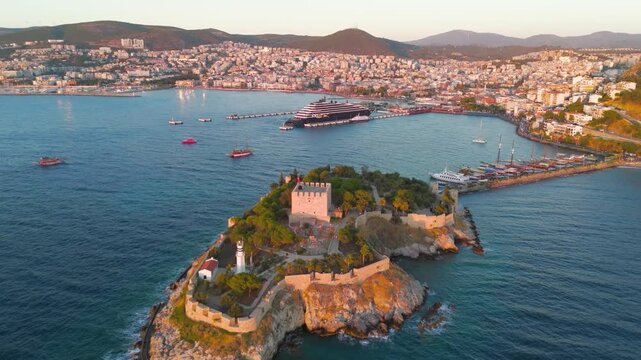 Kusadasi, Turkey. Historic Pigeon Island Fortress at sunset. Top down shot of the Genoese central tower, thick defensive walls, and the park. Aerial View, Point of interest