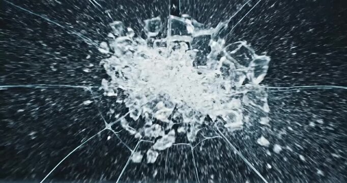 Cracked glass texture with radial spiderweb fractures on black background