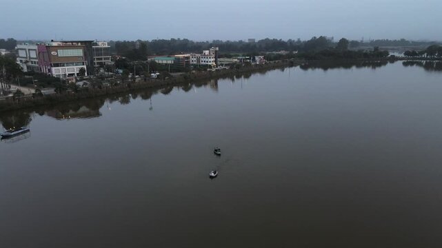 Aerial View of Bathinda City Lake and Urban Landscape at Dusk, Punjab, India.