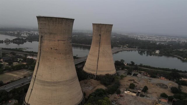 Aerial View of Thermal Power Plant Cooling Towers next to the Lake in Bathinda, Punjab, India.
