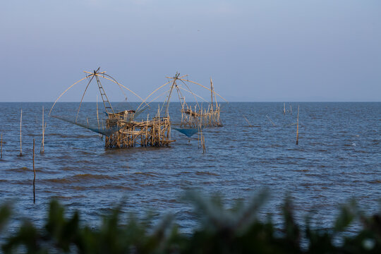 The beauty of sunset of  giant fish trap or a fish trap is a device used to catch large fish by villagers living in the Pak Pra Canal area of ​​Phatthalung Province. It is made from bamboo and rope
