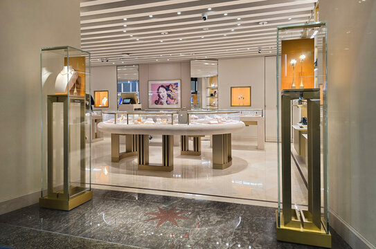 Changi, Singapore - Jan 14, 2026: The interior of a Bvlgari luxury jewelry and watch boutique featuring large illuminated advertising displays at the Changi Airport departure terminal.