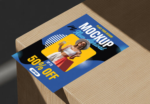 Promotional Flyer Mockup on Wooden Surface with Shadow
