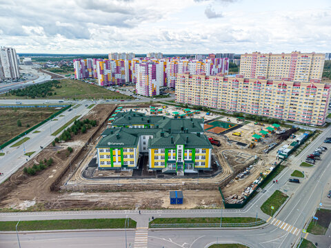 Aerial drone view of Snezhinka Kindergarten (Kindergarten No. 95) before opening with surrounding residential buildings in Tyumen, Russia, September 12, 2022