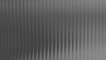 Fototapeta premium Grainy vertical glass ridges on a soft blurred background in grey, silver, dark, and white for modern digital displays