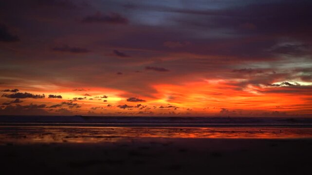 Intense Red and Purple Sunset over Ocean at Kelating Beach