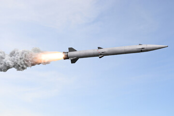 Gray missiles launch skyward, trailing smoke. Clouds drift behind, © faiz