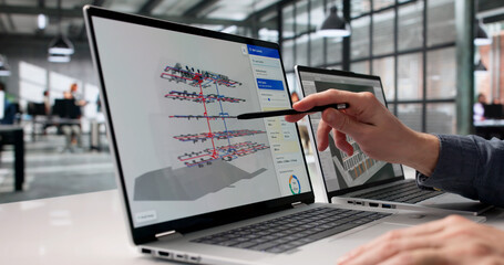 Naklejka na ściany i meble Engineer Examines 3D Digital Twin Mapping With Advanced BIM And GIS Tools
