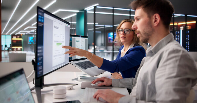 Accountant Analyzing Digital Invoice On Laptop