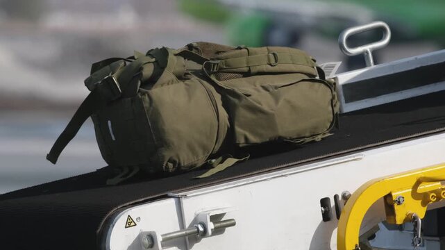 Airplane suitcases luggage baggage conveyor worker at airport terminal airline aircraft. Passengers boarding airplane.