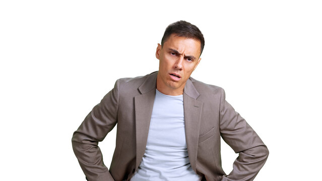 Businessman looking confused and frustrated, posing with hands on hips