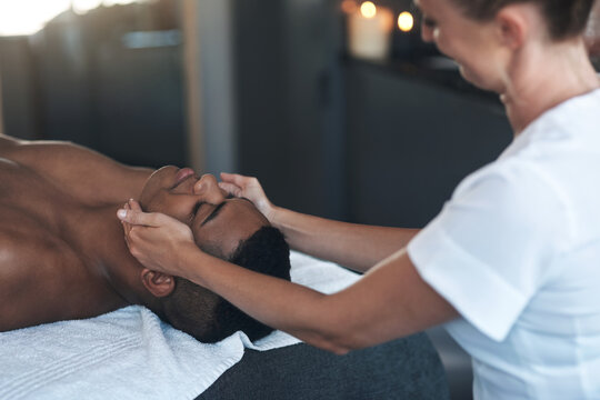 Relax, therapist or man with face massage in spa, skincare treatment or circulation benefits for wellness. Calm, masseuse or client with lymphatic drainage routine, jaw tension release or skin health