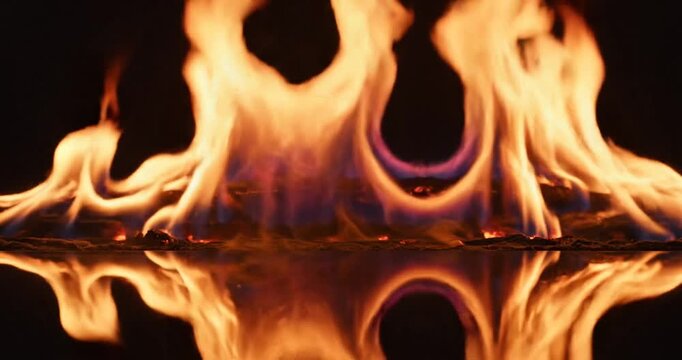 Flames burning on water surface.