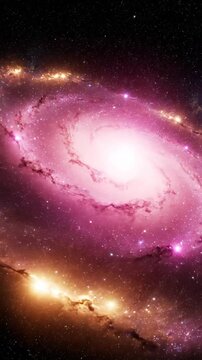 Bright spiral galaxy glows with pink and gold light in deep space creating a majestic cosmic background for astronomy science and wonder themesspiral galaxy