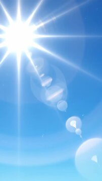 Bright starburst light breaks through the frame on a clear blue sky creating a clean abstract nature and energy backgroundsunburst