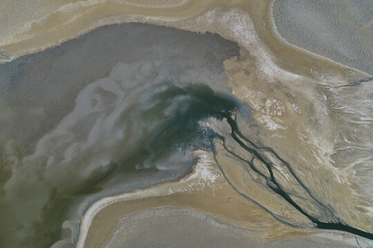 Strange Patterns in Evaporation Ponds in Industrial Wasteland in