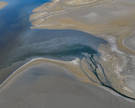 Strange Patterns in Evaporation Ponds in Industrial Wasteland in
